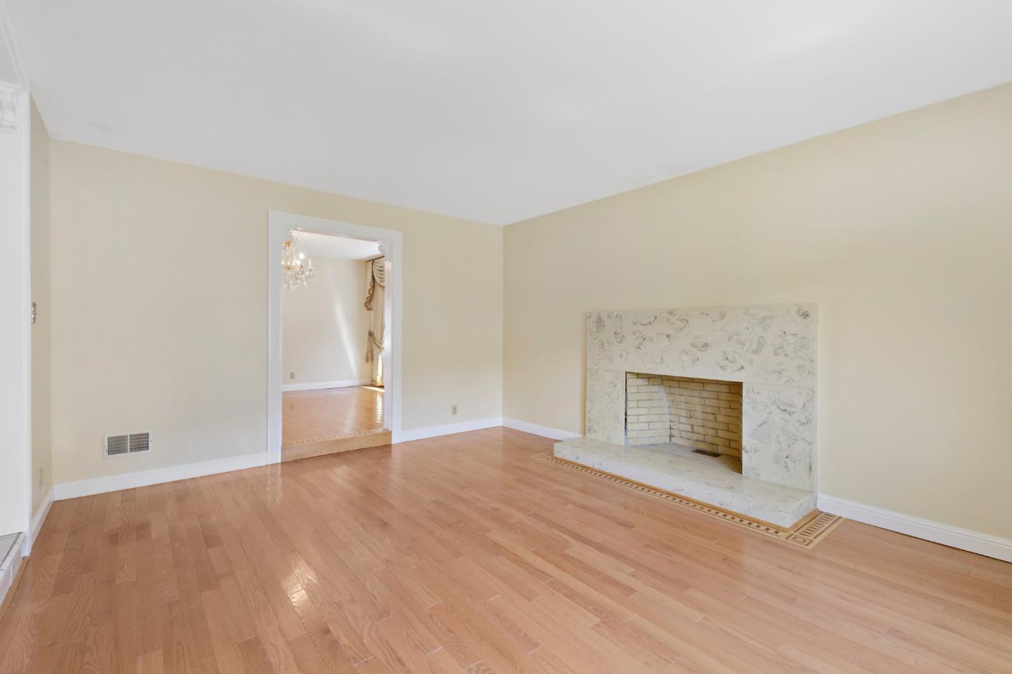 750 Clearfield Drive Millbrae, CA 94030 - Photo 9 of 35 a view of an empty room with wooden floor and a window