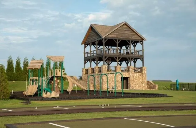 a view of a golf course with a bench