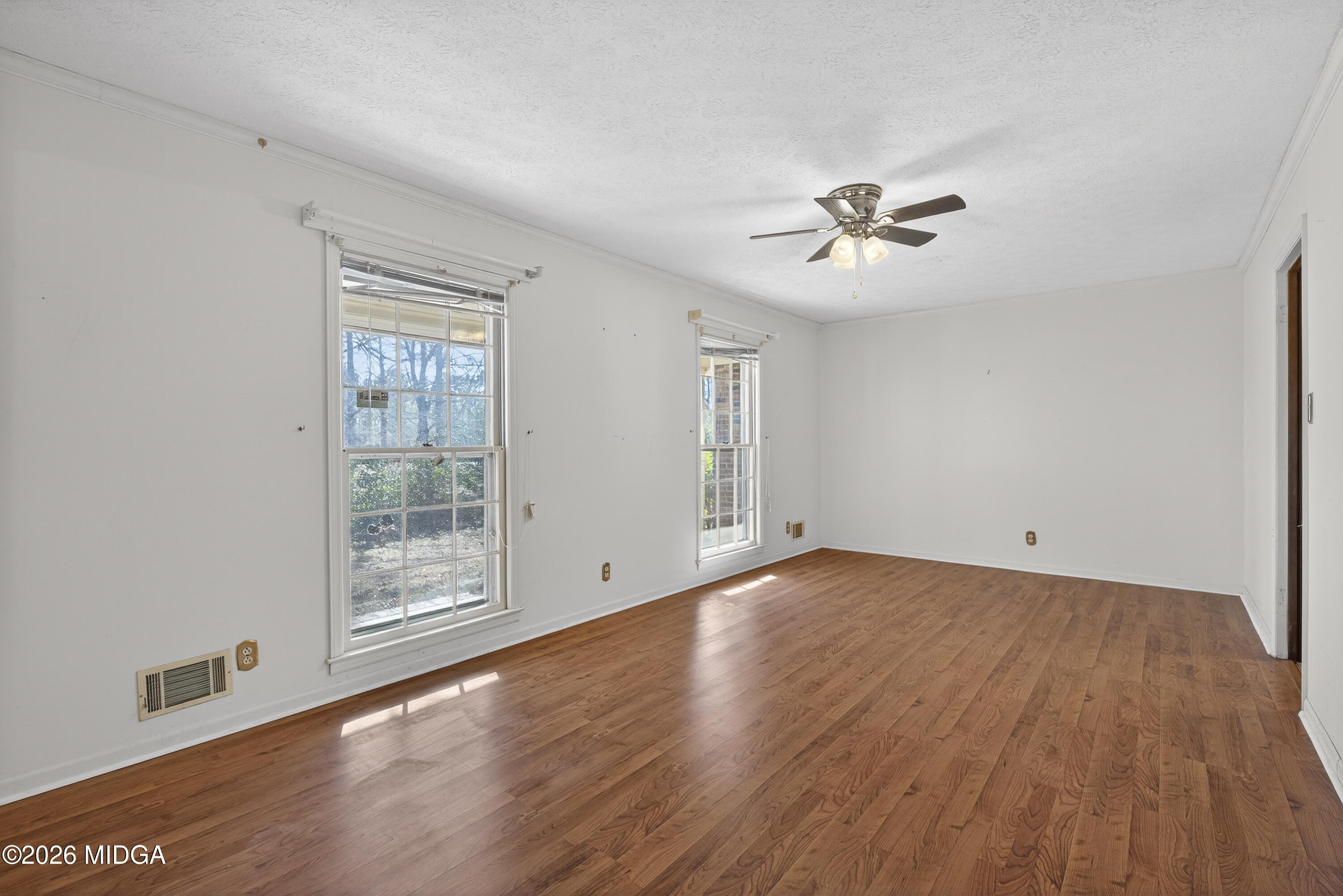 1775 Lower Hartley Bridge Road Byron, GA 31008 - Photo 12 of 51 wooden floor in an empty room with a window