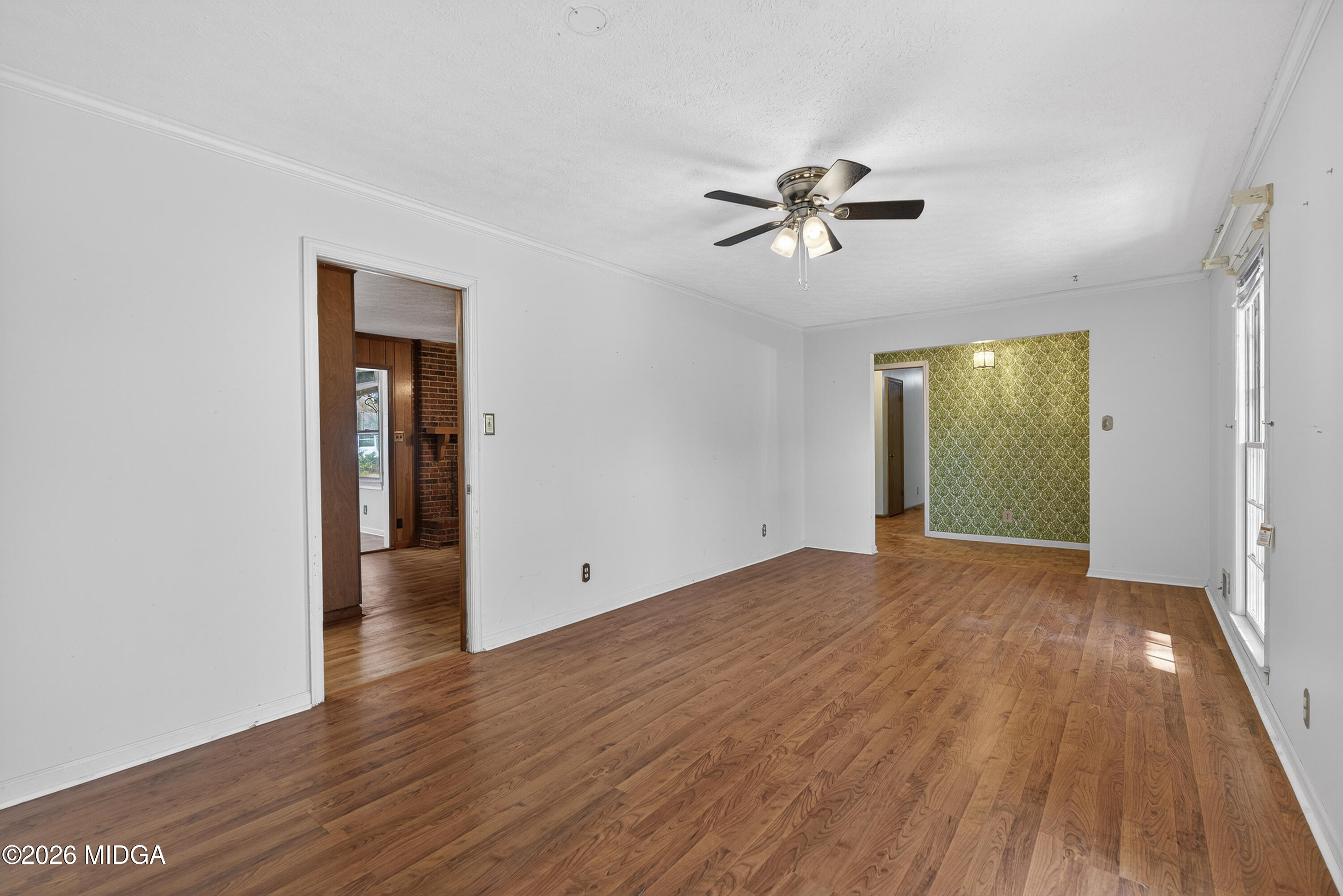 1775 Lower Hartley Bridge Road Byron, GA 31008 - Photo 13 of 51 wooden floor in an empty room with a window