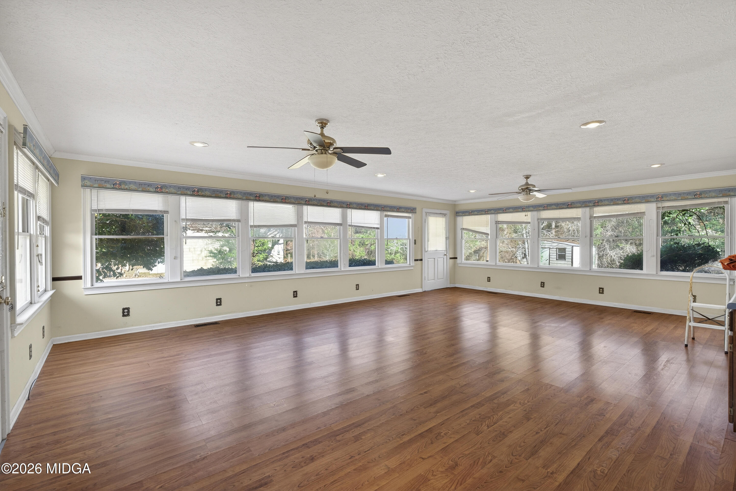 1775 Lower Hartley Bridge Road Byron, GA 31008 - Photo 26 of 51 a view of an empty room with wooden floor and a window