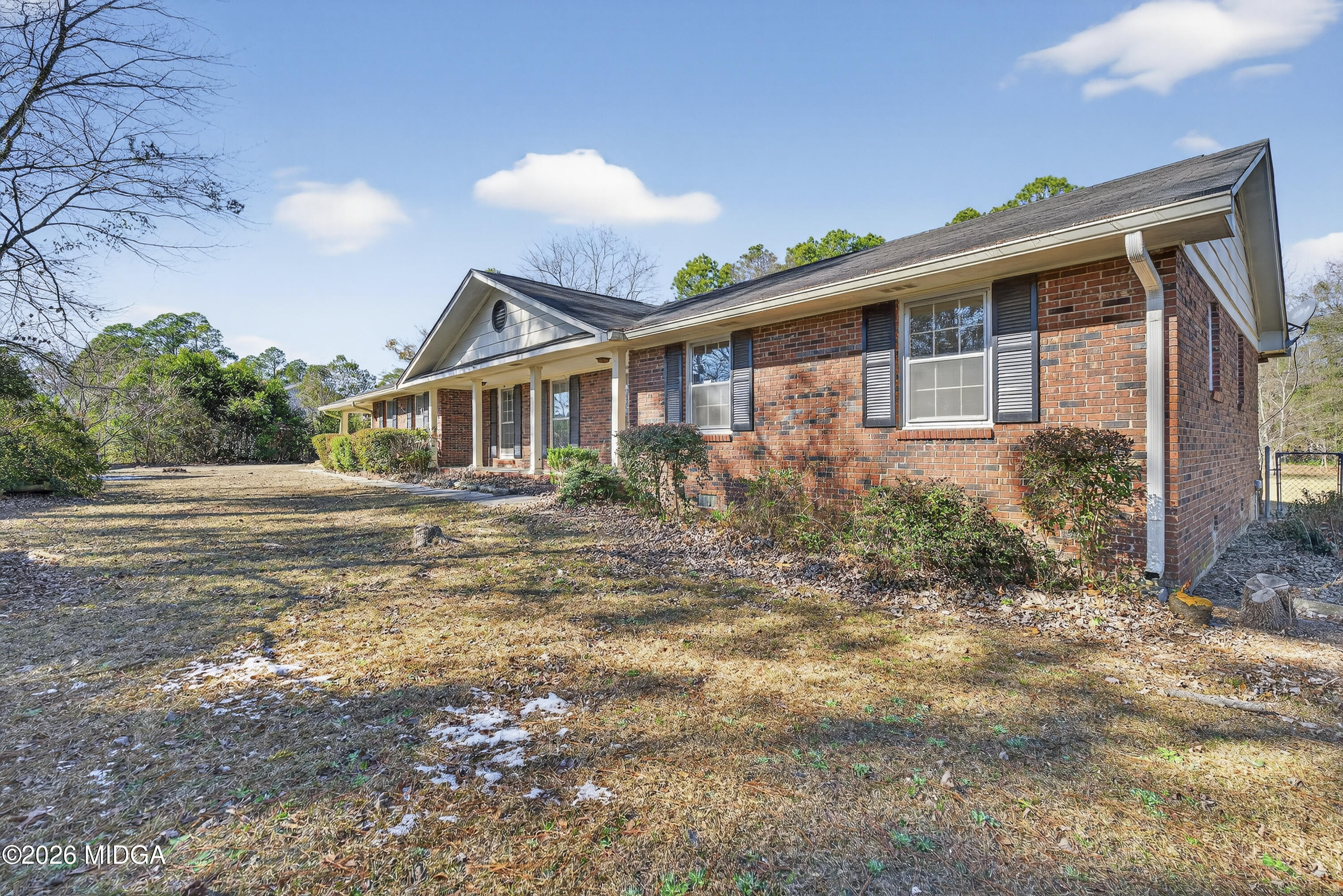 1775 Lower Hartley Bridge Road Byron, GA 31008 - Photo 3 of 51 a front view of a house with garden