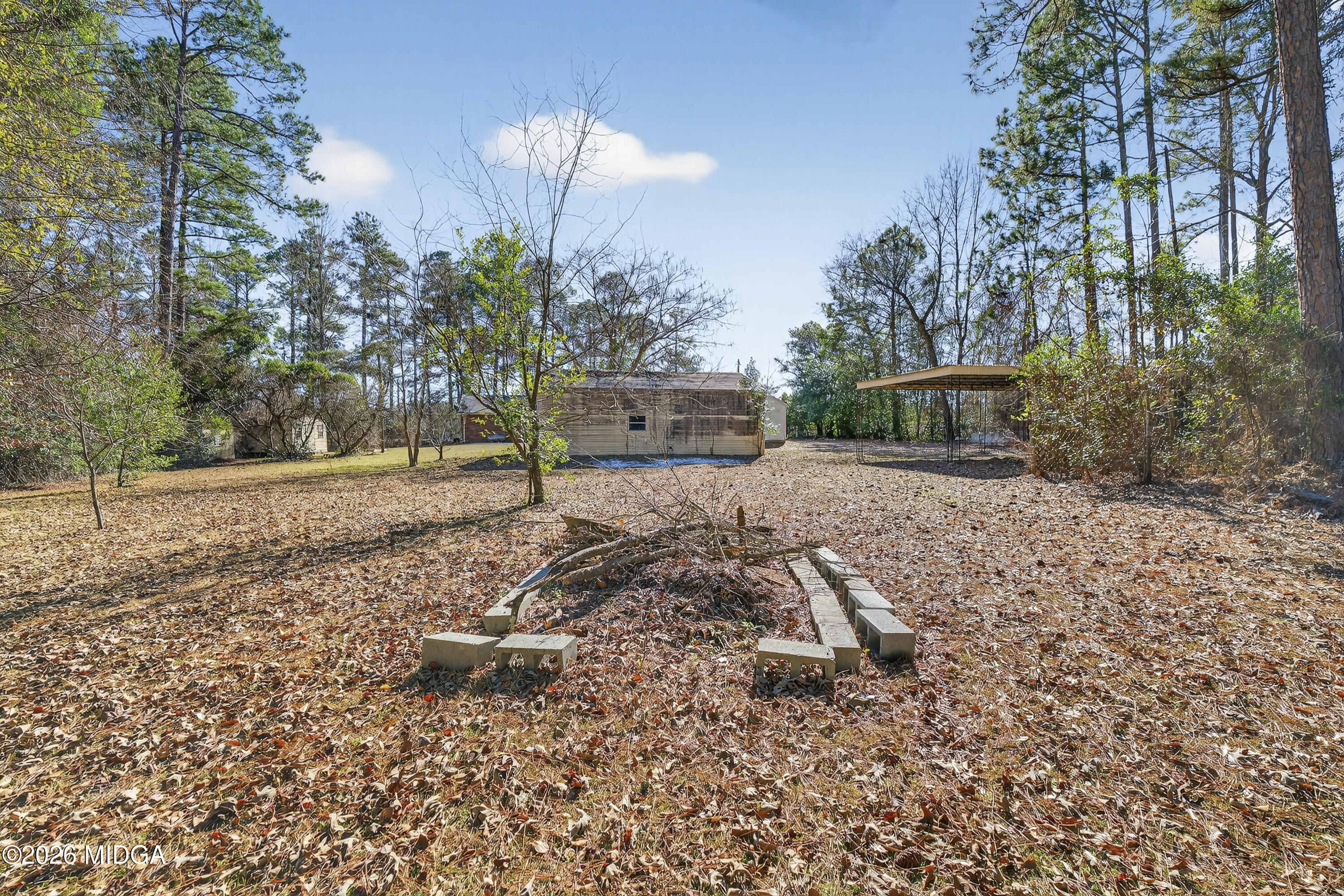 1775 Lower Hartley Bridge Road Byron, GA 31008 - Photo 32 of 51 a view of a backyard of the house