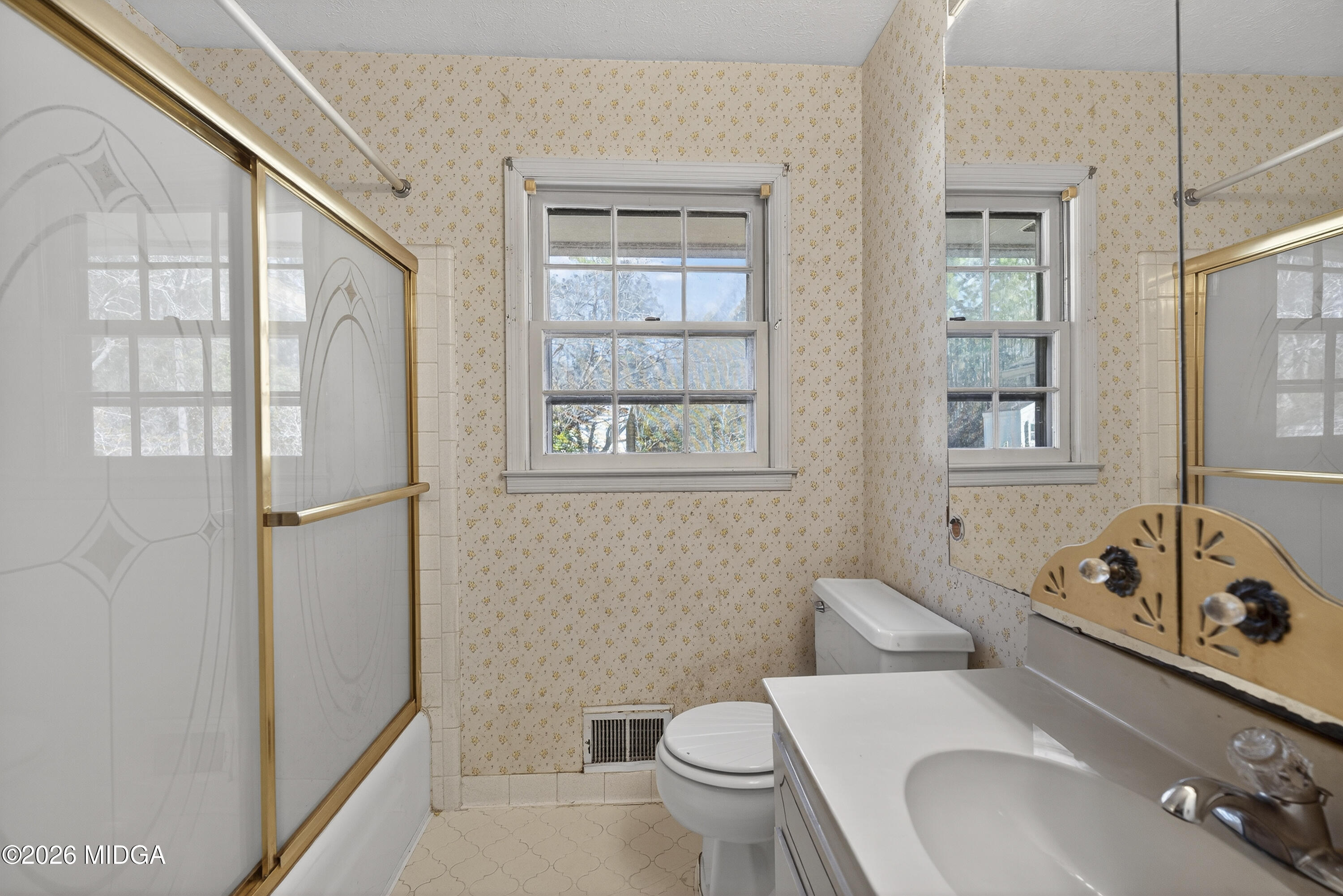 1775 Lower Hartley Bridge Road Byron, GA 31008 - Photo 33 of 51 a bathroom with a toilet sink and mirror