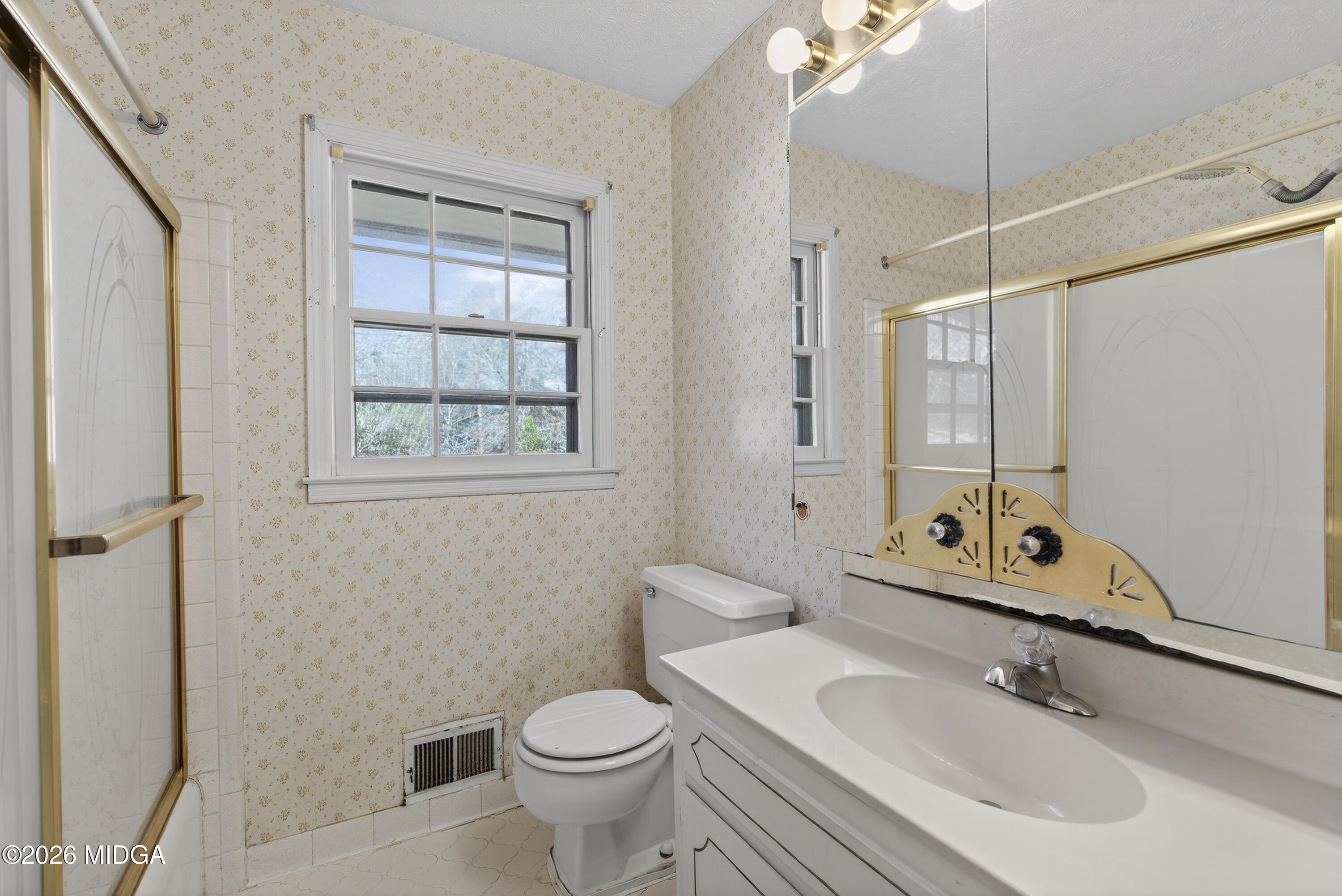 1775 Lower Hartley Bridge Road Byron, GA 31008 - Photo 34 of 51 a bathroom with a sink toilet and shower