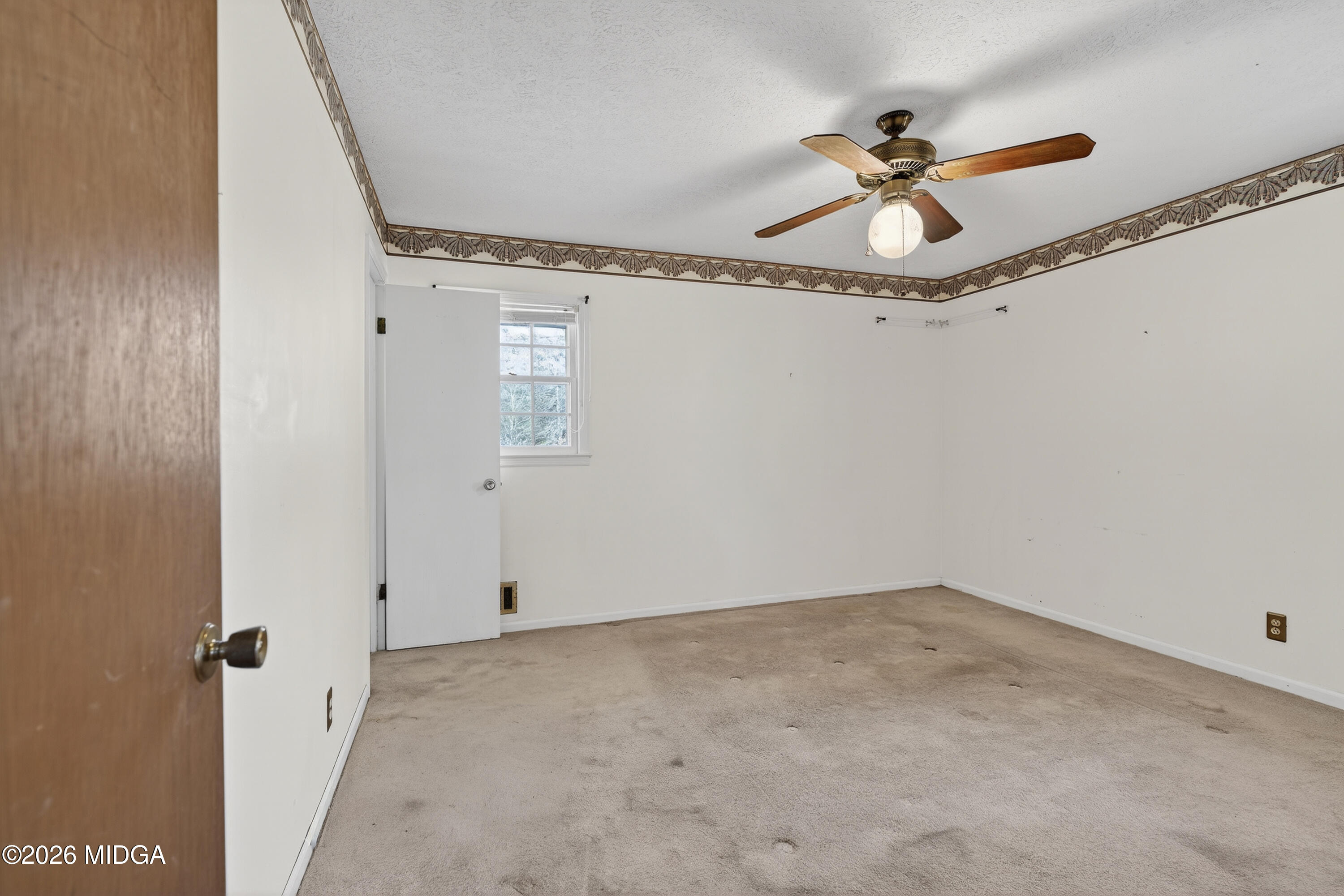 1775 Lower Hartley Bridge Road Byron, GA 31008 - Photo 40 of 51 a view of a room with cabinet with a ceiling fan