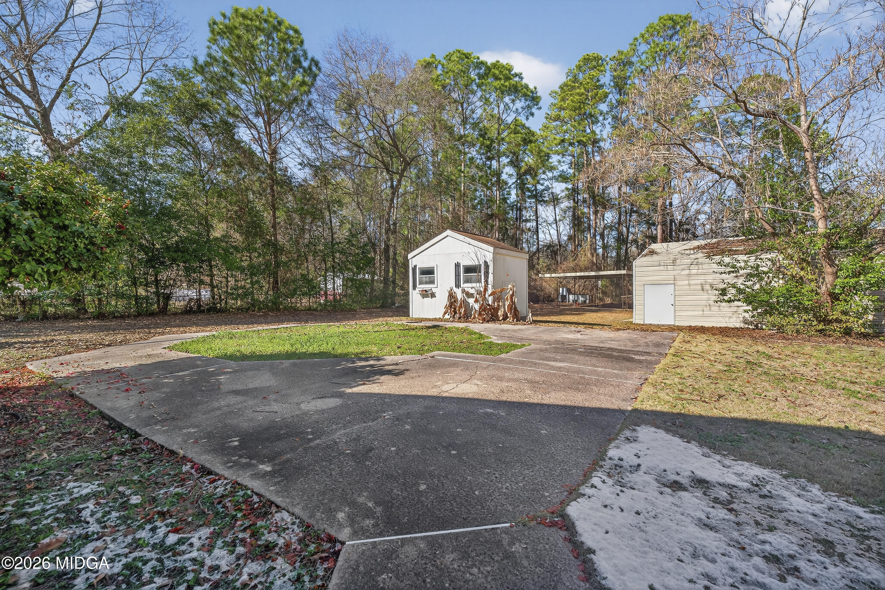 1775 Lower Hartley Bridge Road Byron, GA 31008 - Photo 45 of 51 a sign board with yard in the back