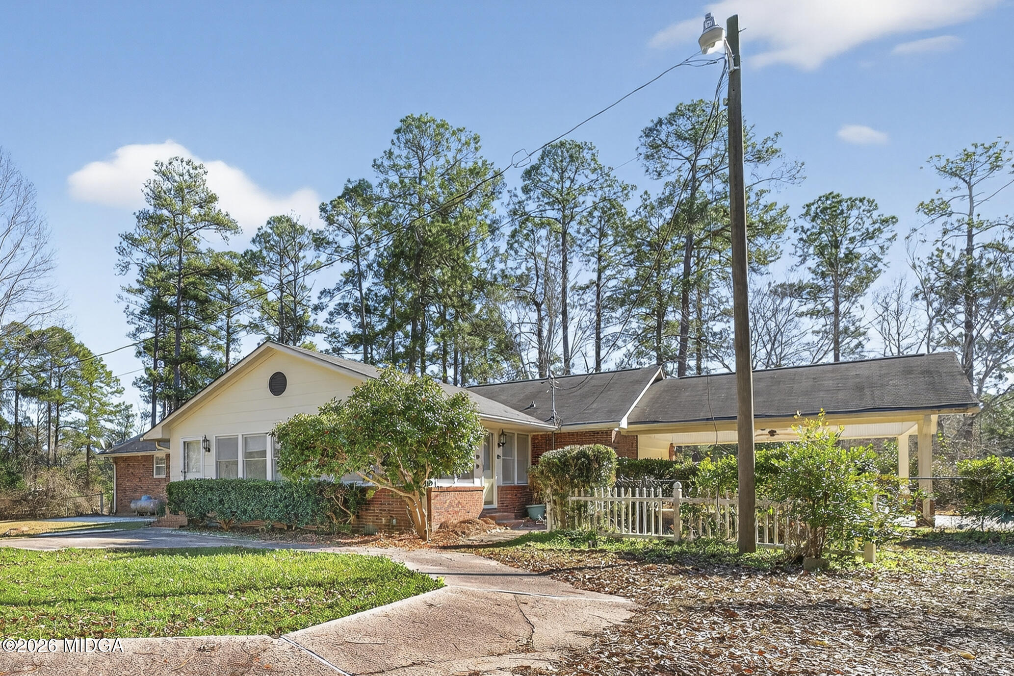 1775 Lower Hartley Bridge Road Byron, GA 31008 - Photo 47 of 51 a front view of a house with a yard and trees