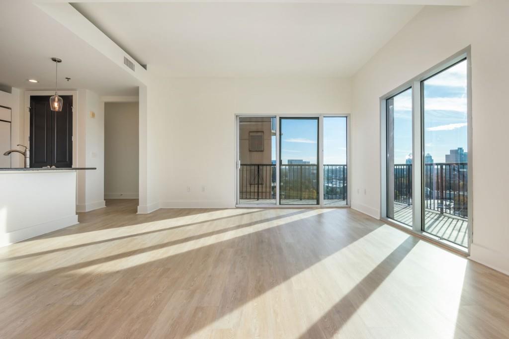 4561 Olde Perimeter Way, Unit 1701 Atlanta, GA 30346 - Photo 12 of 60 a view of an entryway with wooden floor and door