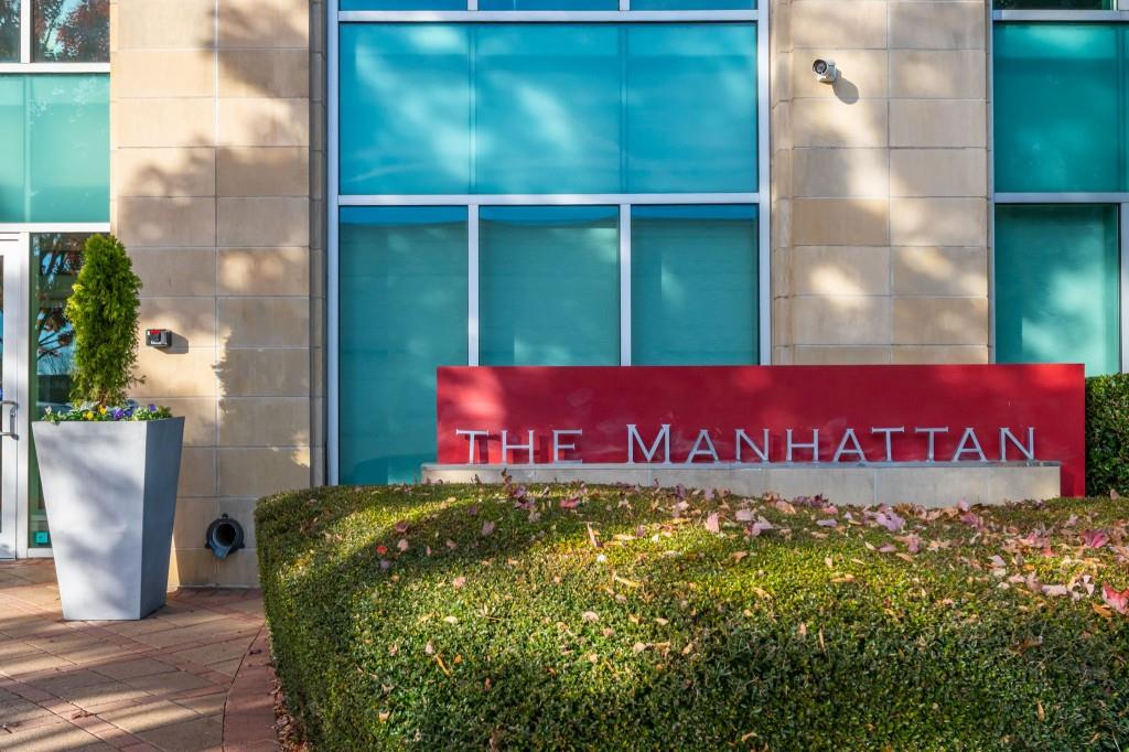 4561 Olde Perimeter Way, Unit 1701 Atlanta, GA 30346 - Photo 2 of 60 a sign that is sitting on a brick wall