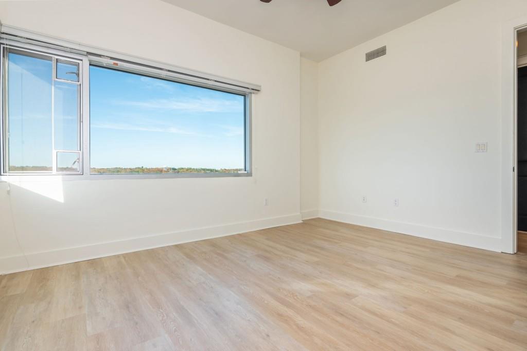 4561 Olde Perimeter Way, Unit 1701 Atlanta, GA 30346 - Photo 28 of 60 an empty room with a window