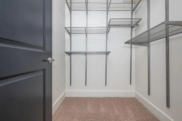 a view of living room with furniture and wooden floor
