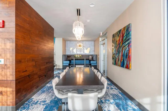 a view of a tables and chairs in patio with a potted plant
