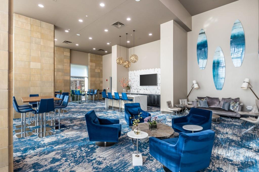 4561 Olde Perimeter Way, Unit 1701 Atlanta, GA 30346 - Photo 34 of 60 a living room with furniture kitchen view and a large window