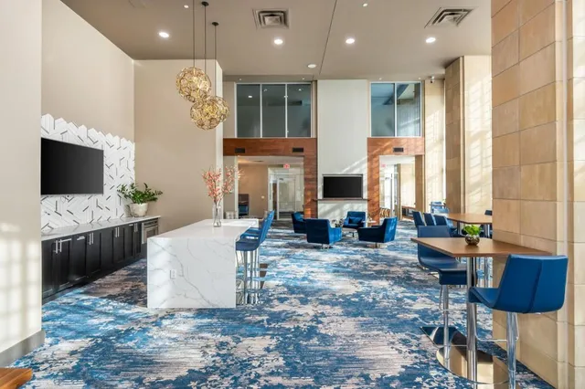 a room with furniture pool table and window