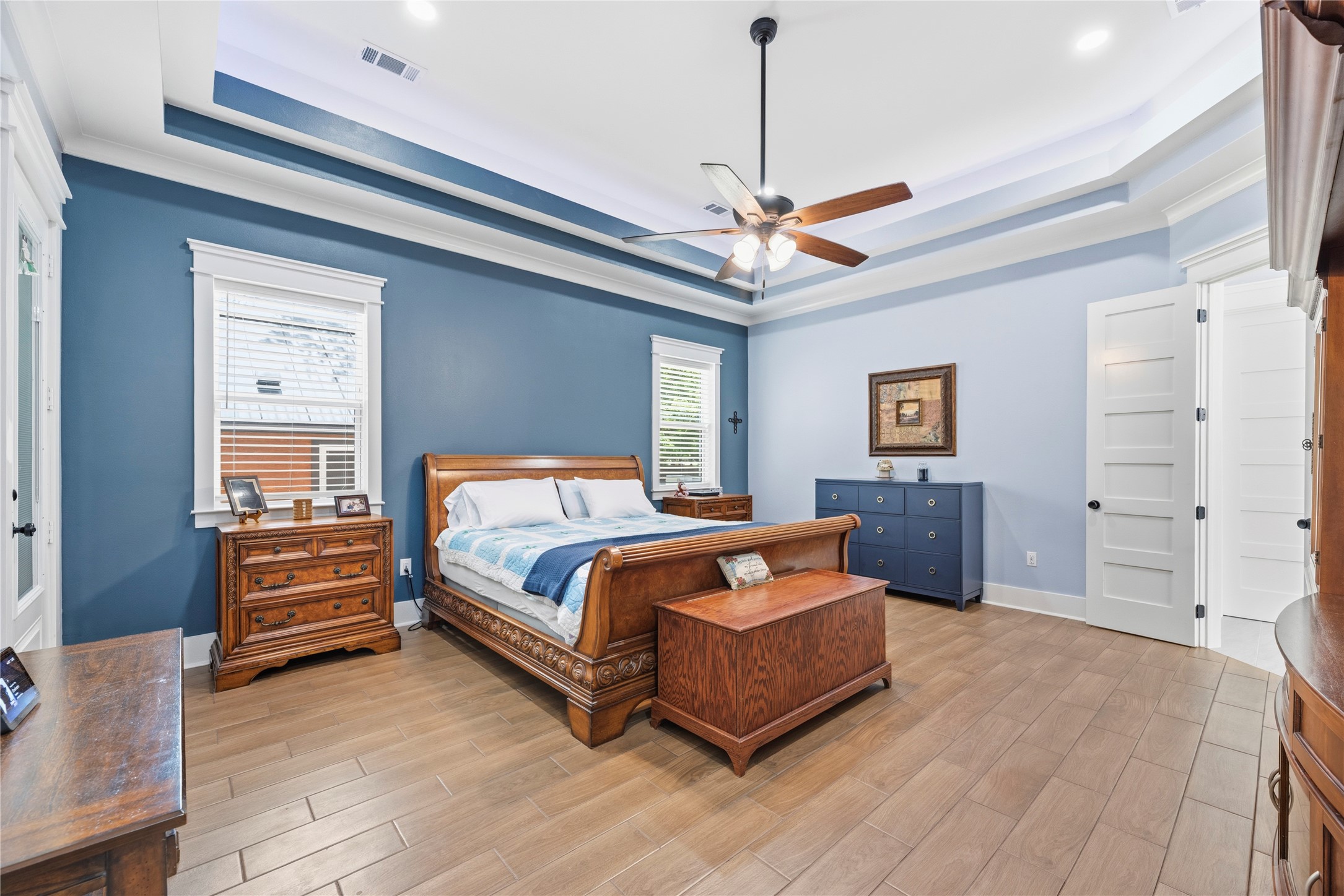 4607 Clayhead Road Richmond, TX 77406 - Photo 15 of 49 A serene owner’s retreat showcasing tray ceilings, rich designer tones, and an expansive layout crafted for elevated comfort and privacy.