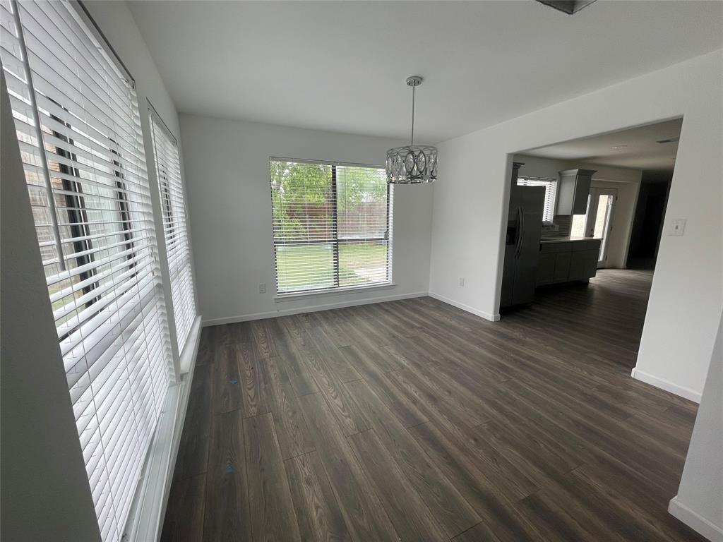3 Ridge Drive Hickory Creek, TX 75065 - Photo 5 of 20 wooden floor in an empty room with a window