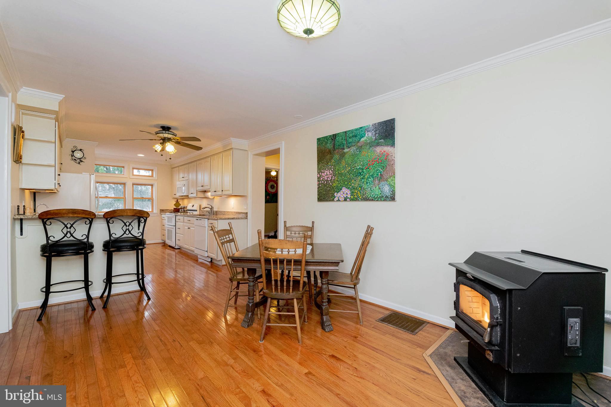 16 Holy Cross Road Street, MD 21154 - Photo 10 of 53 Dining Area with Pellet Stove