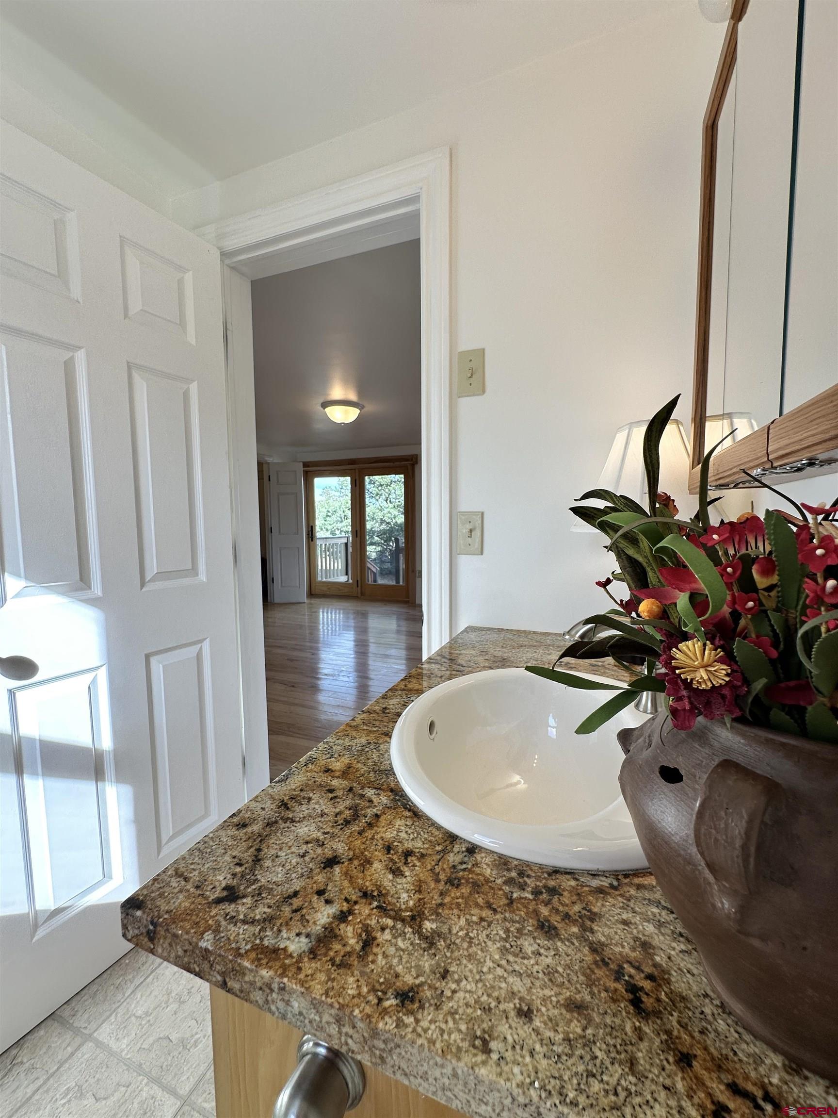 351 Loveland Road South Fork, CO 81154 - Photo 14 of 45 a bathroom with a sink and a mirror