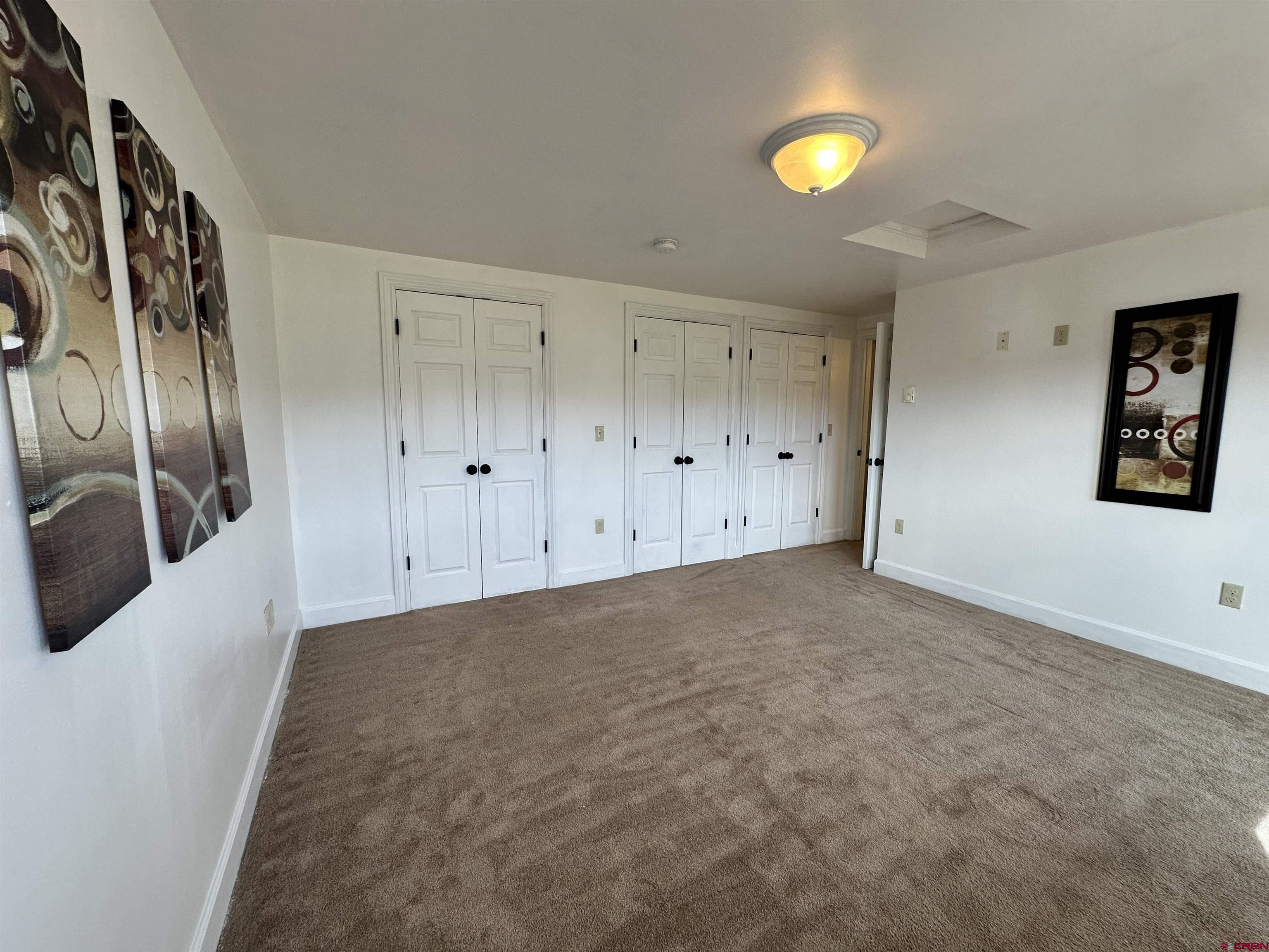 351 Loveland Road South Fork, CO 81154 - Photo 25 of 45 a view of an empty room with window and wooden floor