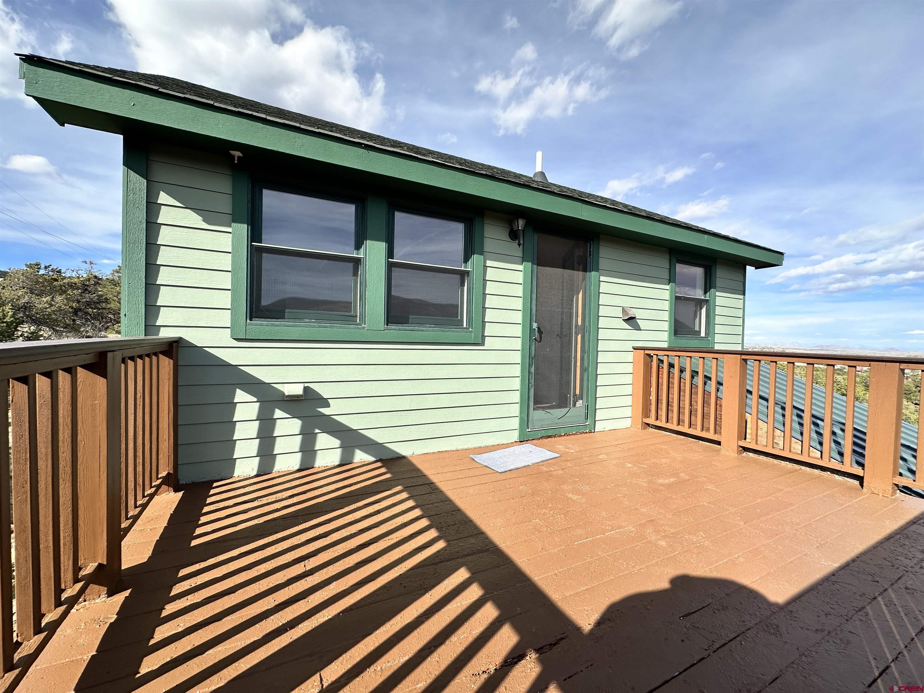 351 Loveland Road South Fork, CO 81154 - Photo 29 of 45 a view of a house with wooden deck