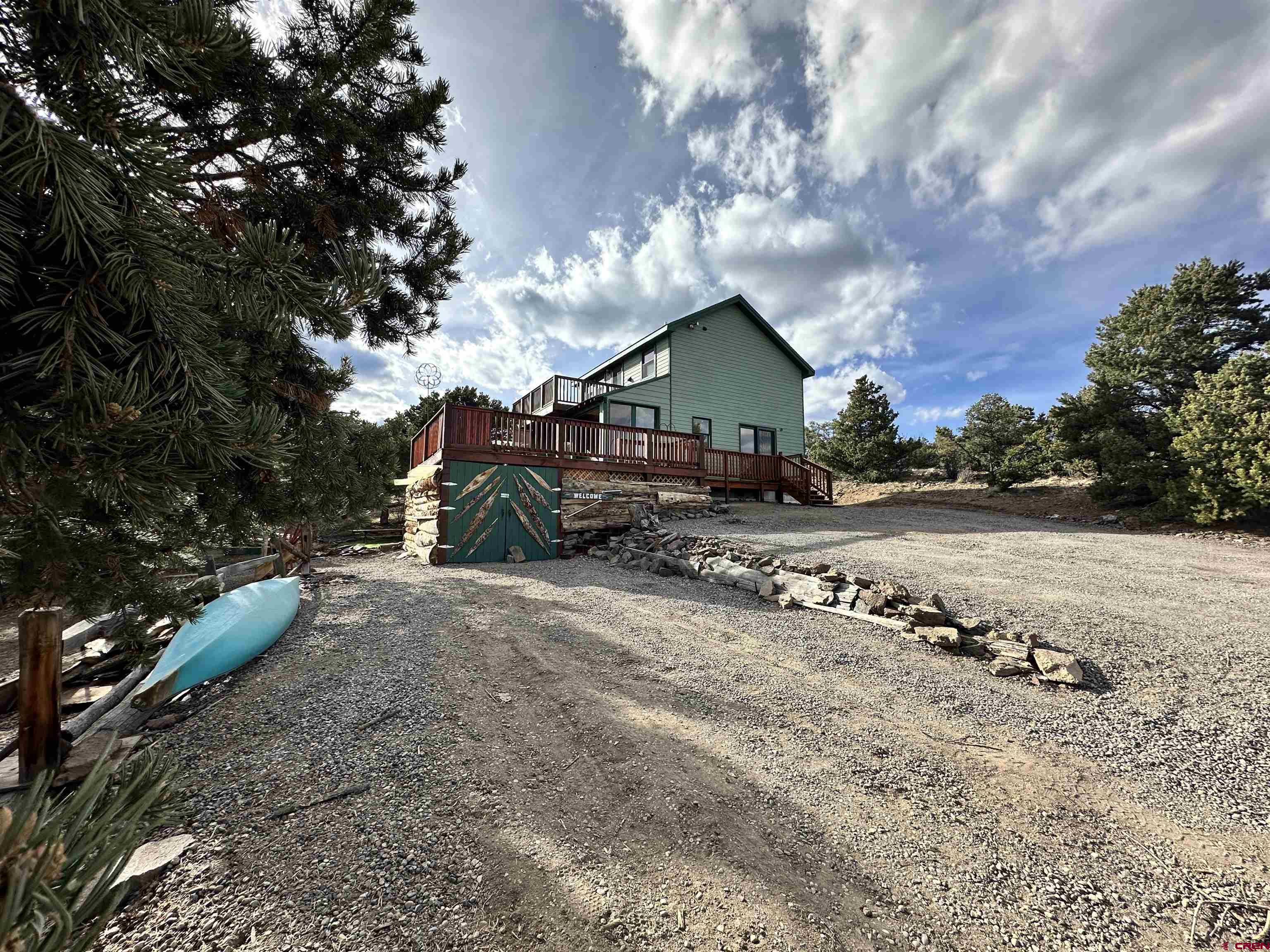 351 Loveland Road South Fork, CO 81154 - Photo 43 of 45 a view of a dirt road with a building in the background