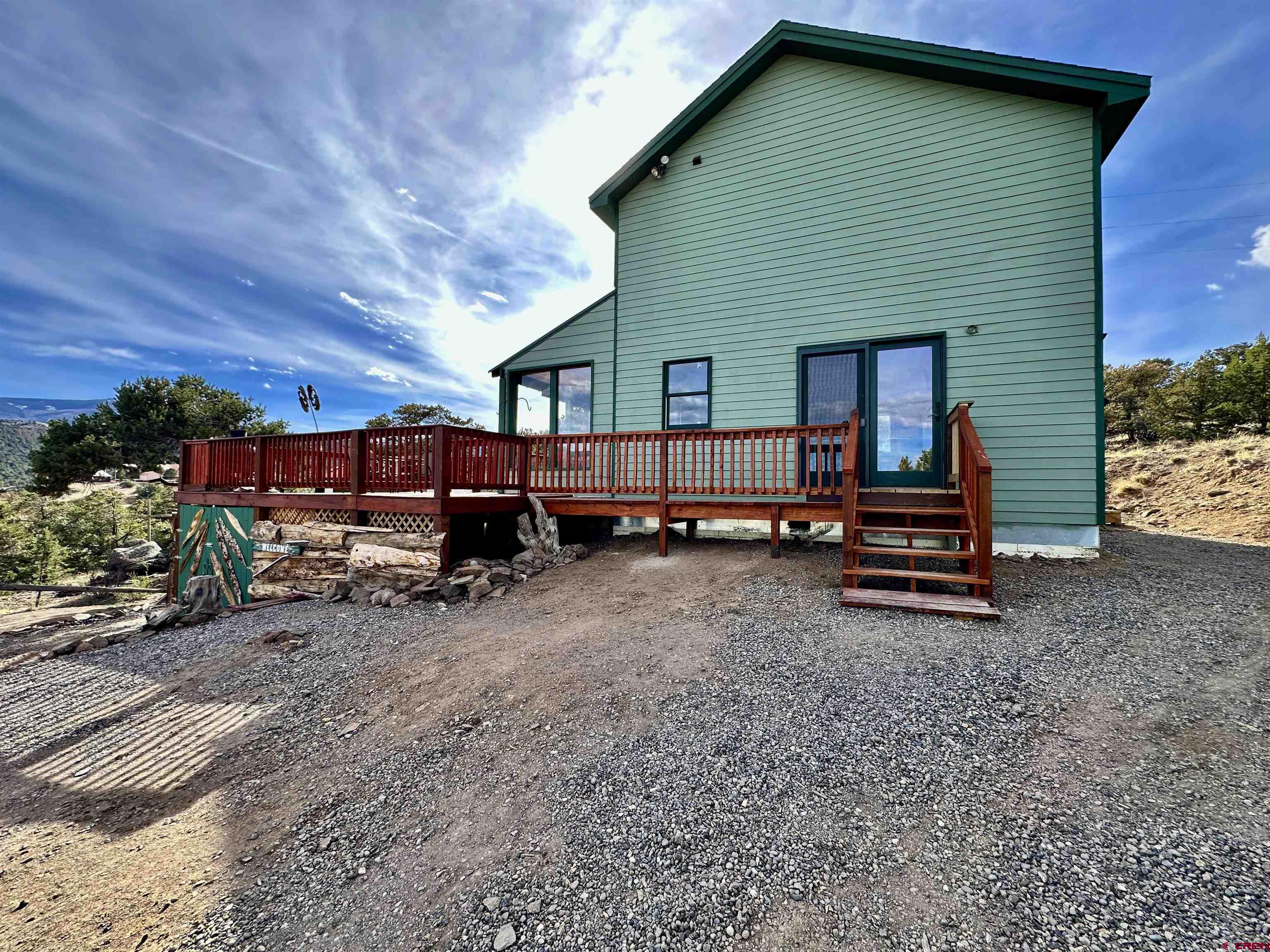 351 Loveland Road South Fork, CO 81154 - Photo 5 of 45 a view of a house with a yard and roof