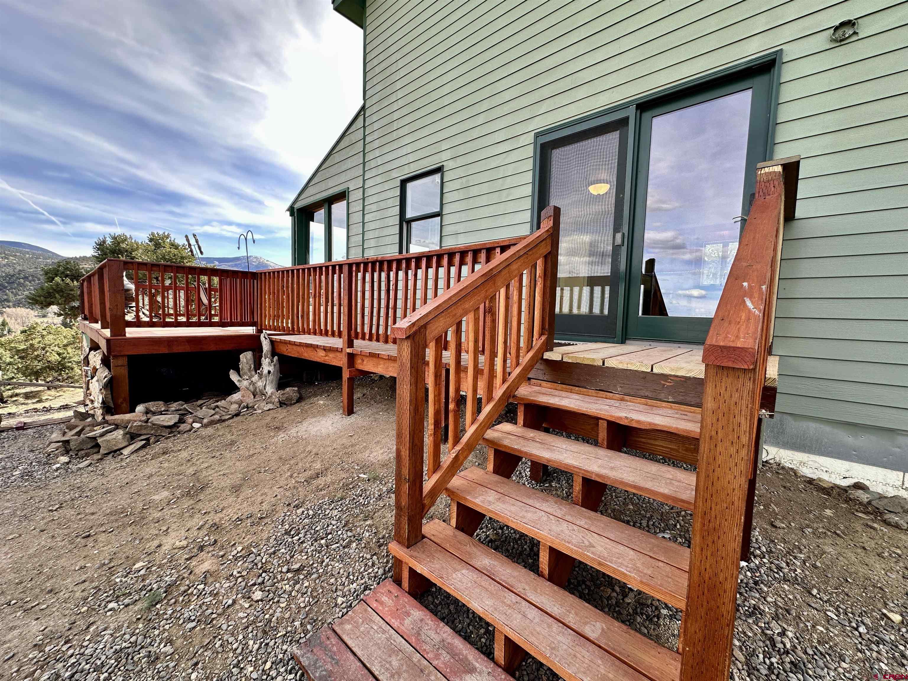 351 Loveland Road South Fork, CO 81154 - Photo 6 of 45 a view of balcony with wooden floor and furniture