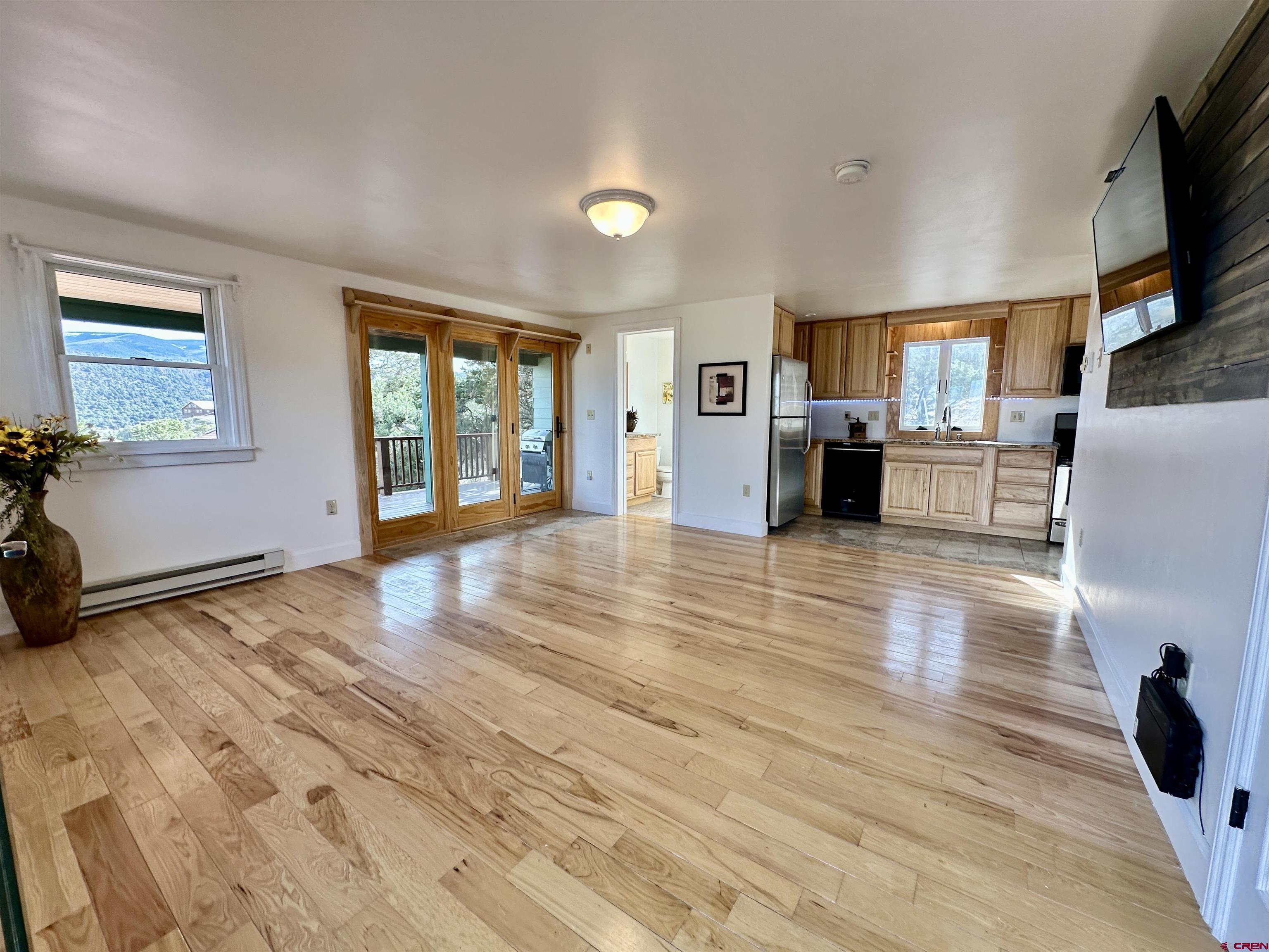351 Loveland Road South Fork, CO 81154 - Photo 8 of 45 a view of a living room kitchen and a wooden floor