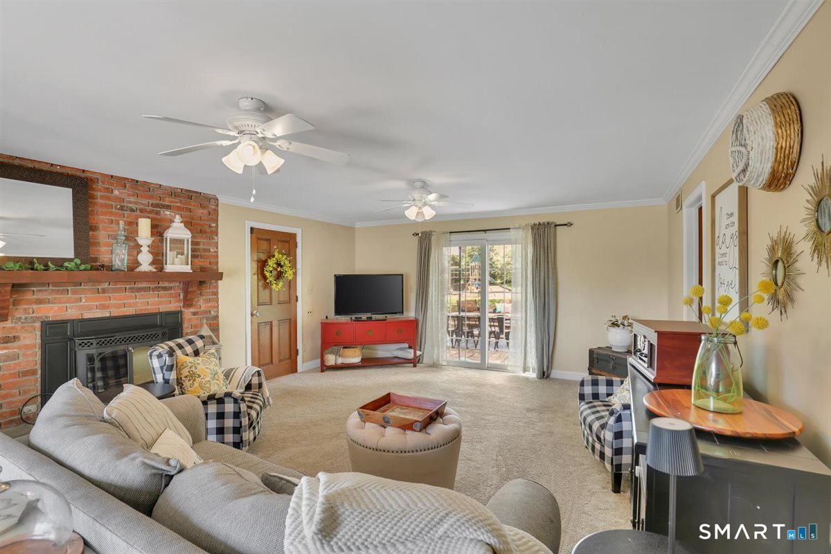 72 Old Post Road Wethersfield, CT 06109 - Photo 4 of 40 a living room with furniture fireplace and flat screen tv