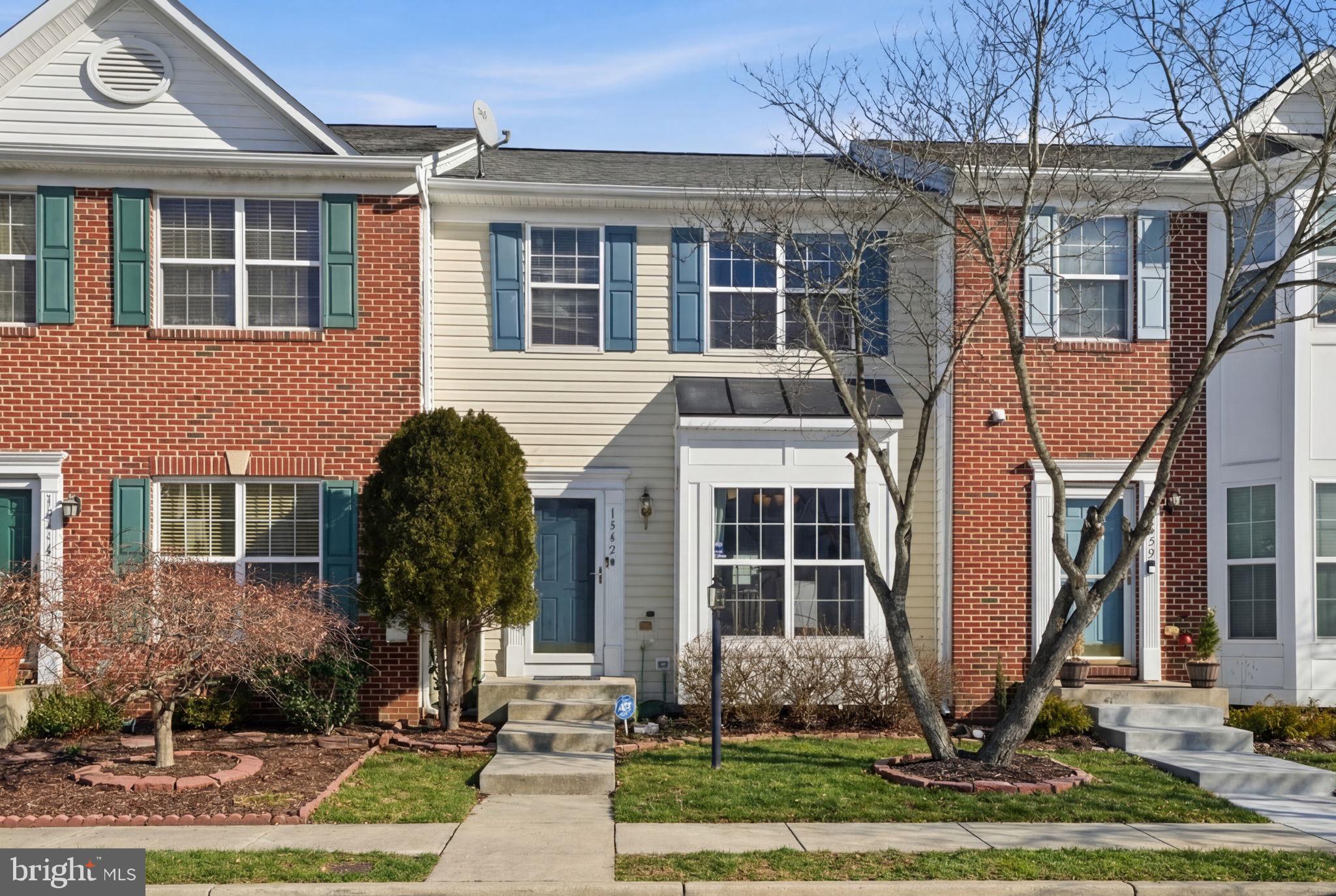 15420 Kennett Square Way Brandywine, MD 20613 - Photo 2 of 32 a front view of a house with garden