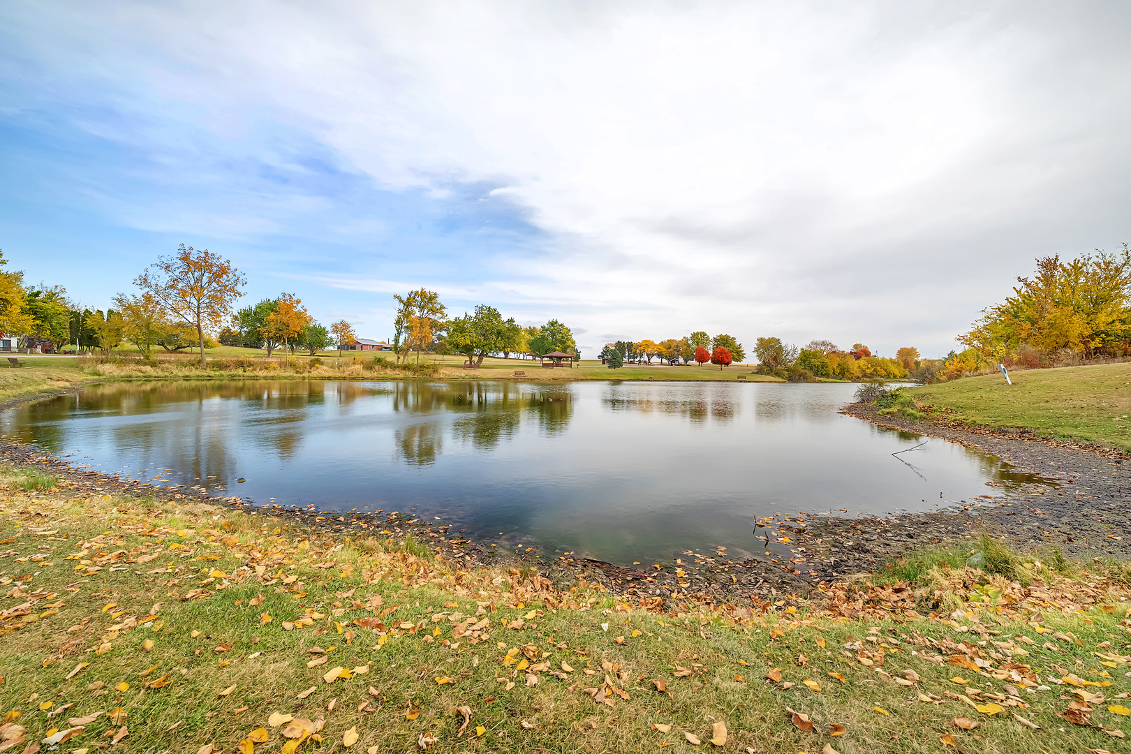 2795 East 28th Road Marseilles, IL 61341 - Photo 50 of 63 a view of a lake with houses in the background