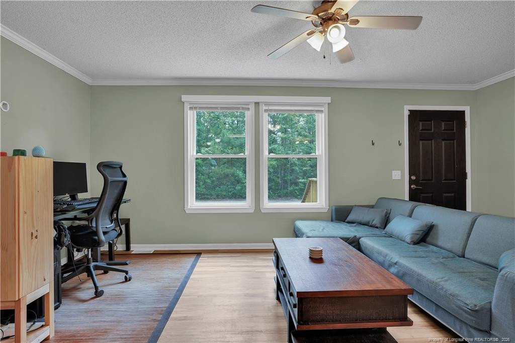 8155 Arabia Road Lumber Bridge, NC 28357 - Photo 5 of 30 a living room with furniture and a window