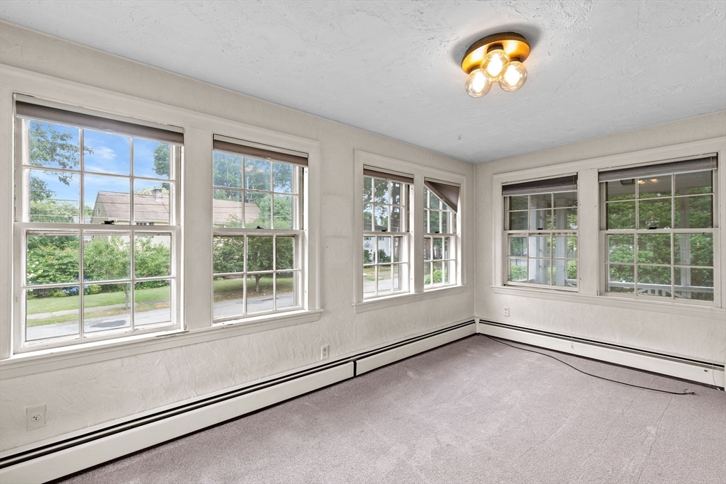 26 Holman Road Newton, MA 02466 - Photo 19 of 42 an empty room with a window