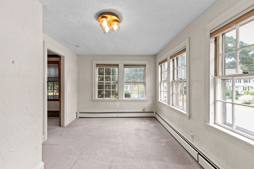 26 Holman Road Newton, MA 02466 - Photo 21 of 42 an empty room with a window