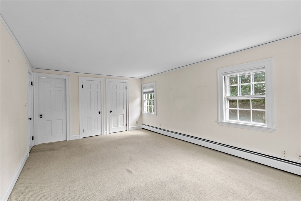 26 Holman Road Newton, MA 02466 - Photo 23 of 42 an empty room with a empty space and windows