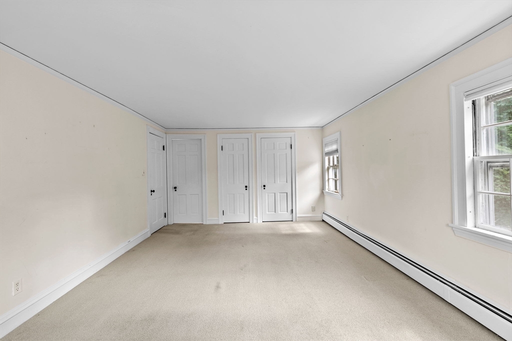 26 Holman Road Newton, MA 02466 - Photo 24 of 42 a view of an empty room with a window