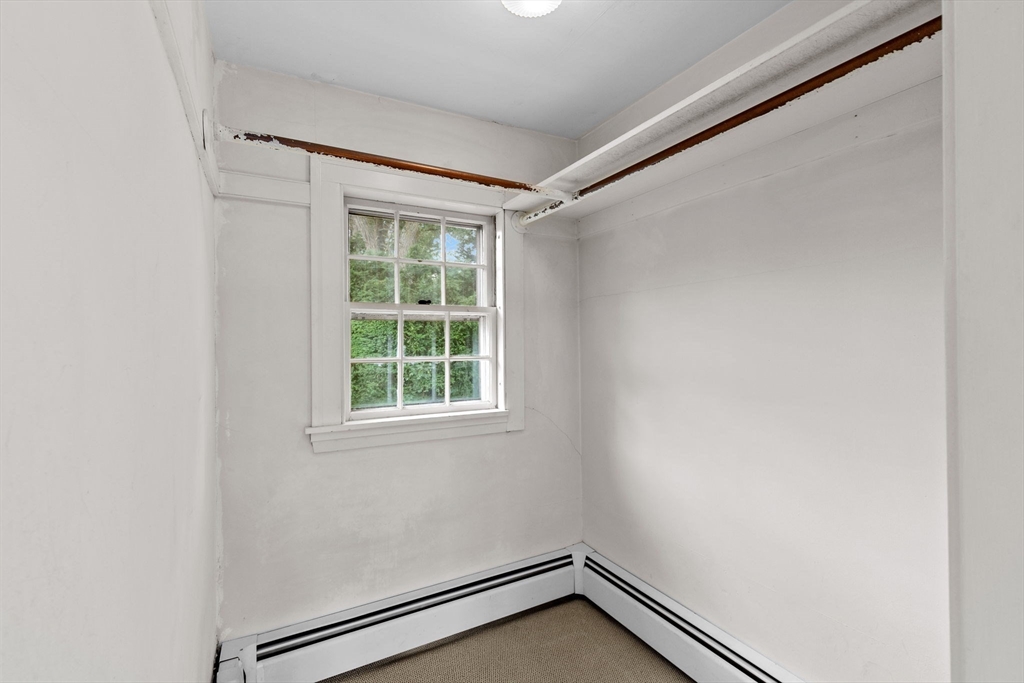 26 Holman Road Newton, MA 02466 - Photo 27 of 42 a view of an empty room with a window