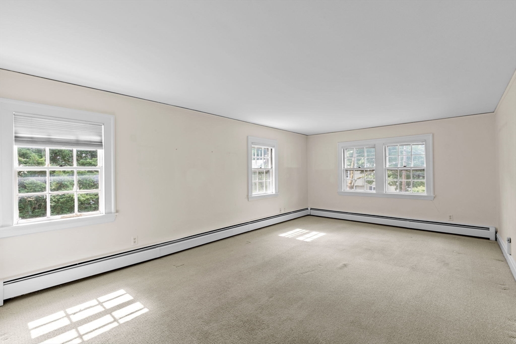 26 Holman Road Newton, MA 02466 - Photo 28 of 42 an empty room with windows