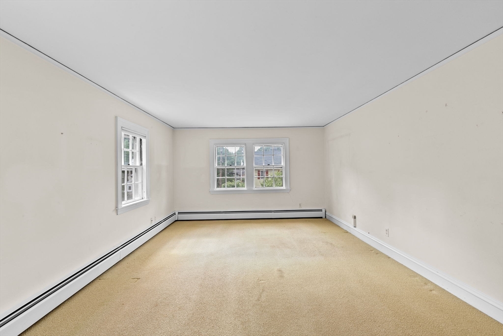 26 Holman Road Newton, MA 02466 - Photo 29 of 42 an empty room with windows