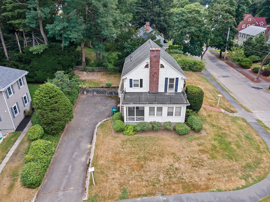 26 Holman Road Newton, MA 02466 - Photo 3 of 42 a front view of a house with a yard