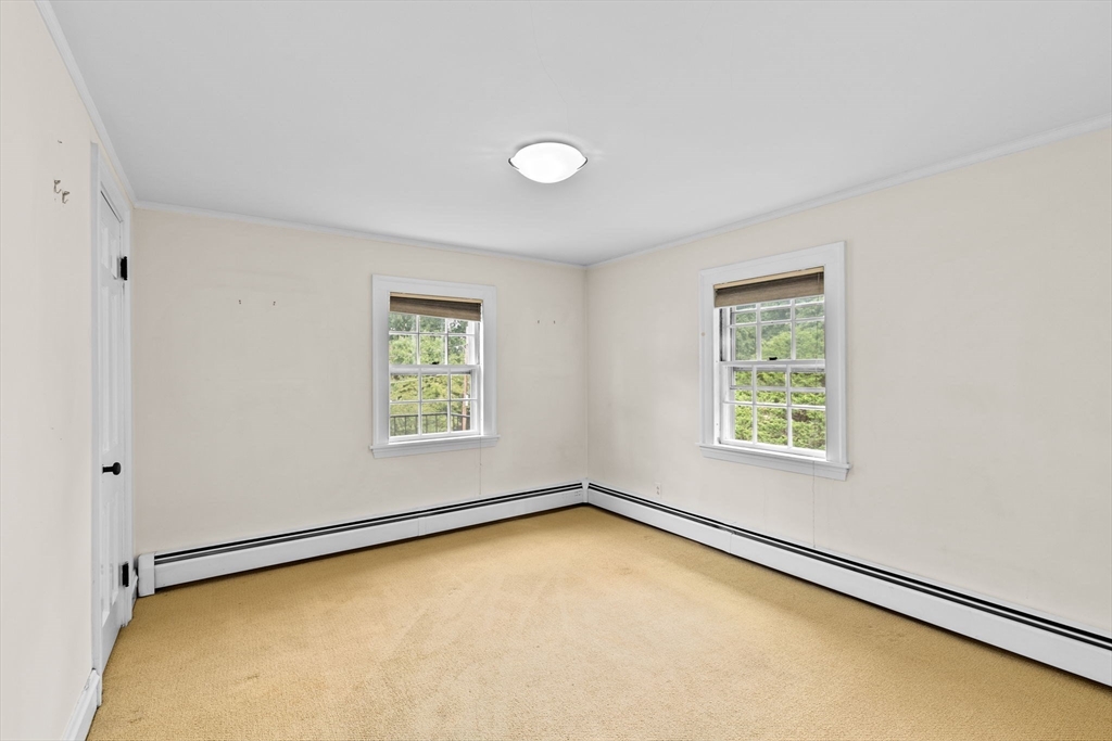 26 Holman Road Newton, MA 02466 - Photo 31 of 42 an empty room with a window