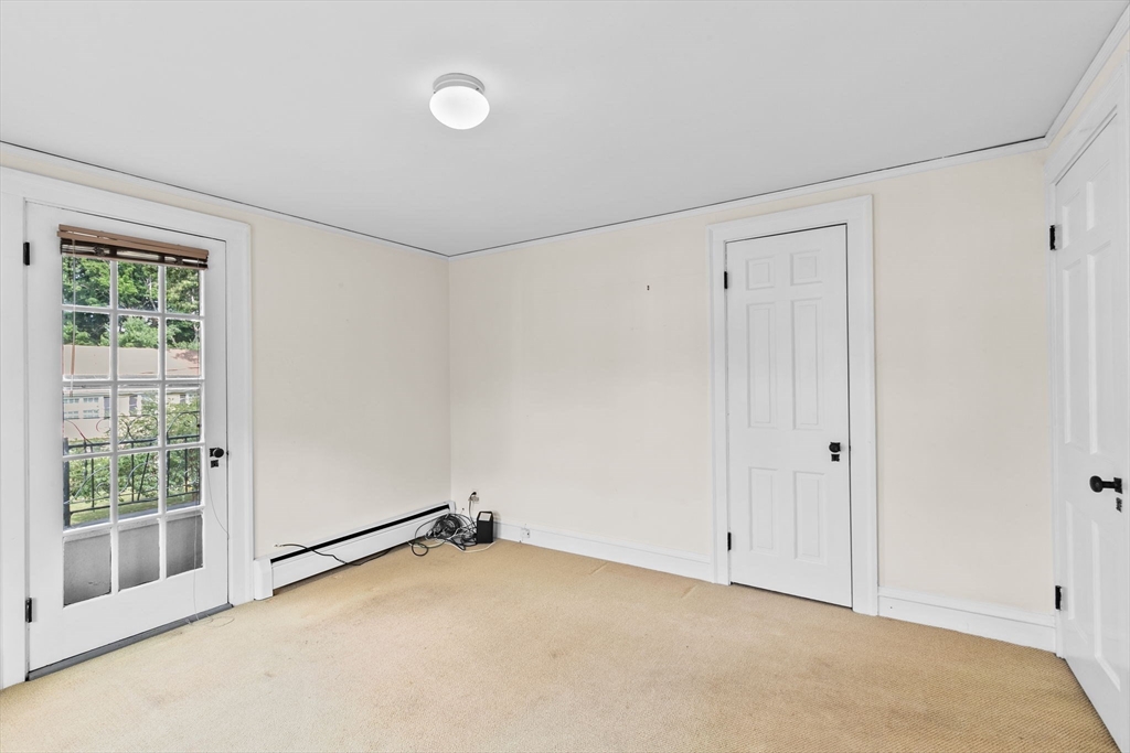 26 Holman Road Newton, MA 02466 - Photo 34 of 42 a view of an empty room with a window