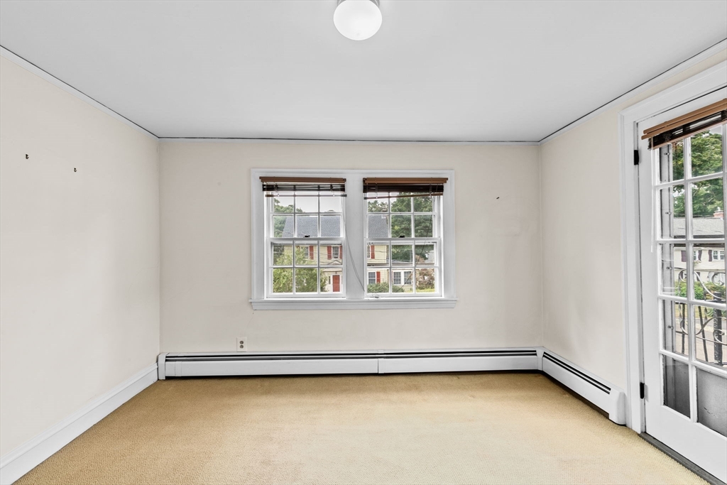 26 Holman Road Newton, MA 02466 - Photo 35 of 42 an empty room with a window
