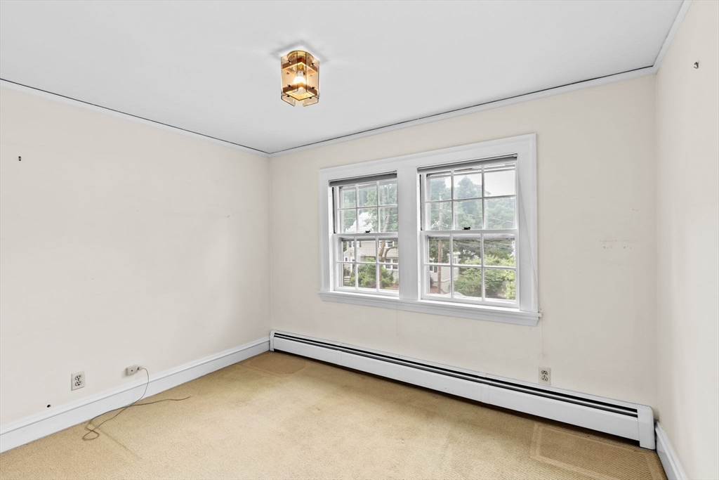 26 Holman Road Newton, MA 02466 - Photo 36 of 42 an empty room with a window