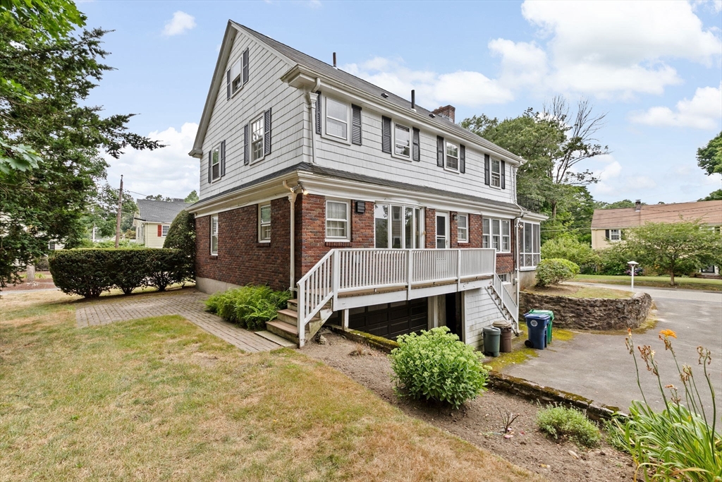 26 Holman Road Newton, MA 02466 - Photo 41 of 42 a front view of a house with a yard and lake view