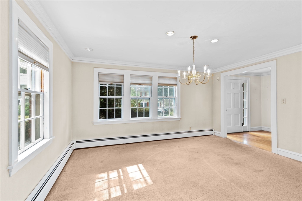 26 Holman Road Newton, MA 02466 - Photo 5 of 42 a view of an empty room with a window