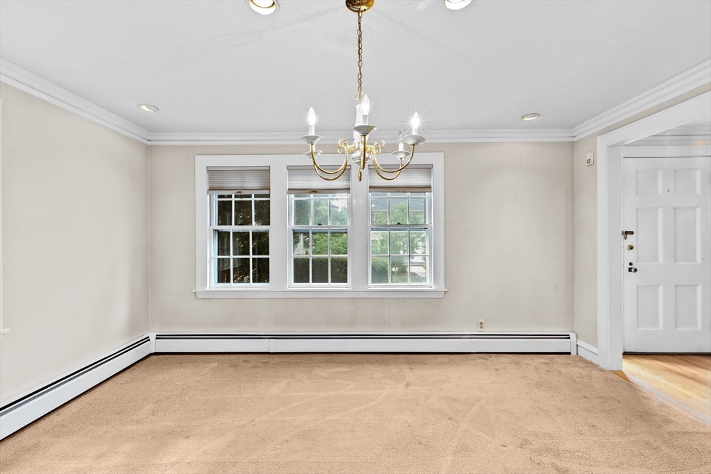 26 Holman Road Newton, MA 02466 - Photo 6 of 42 a view of an empty room with a window