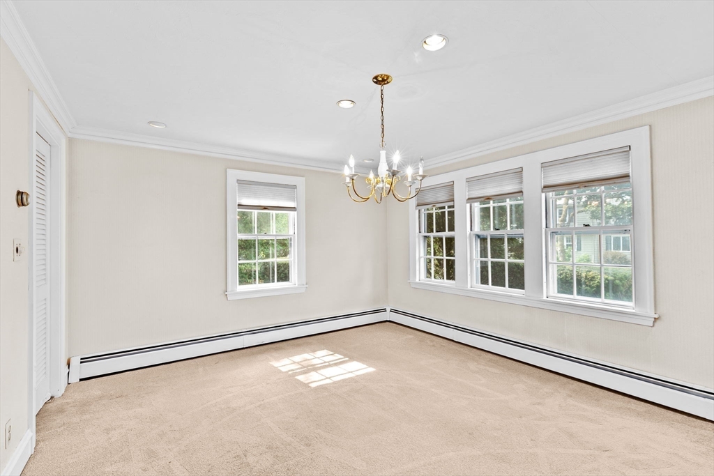 26 Holman Road Newton, MA 02466 - Photo 7 of 42 a view of an empty room with a window