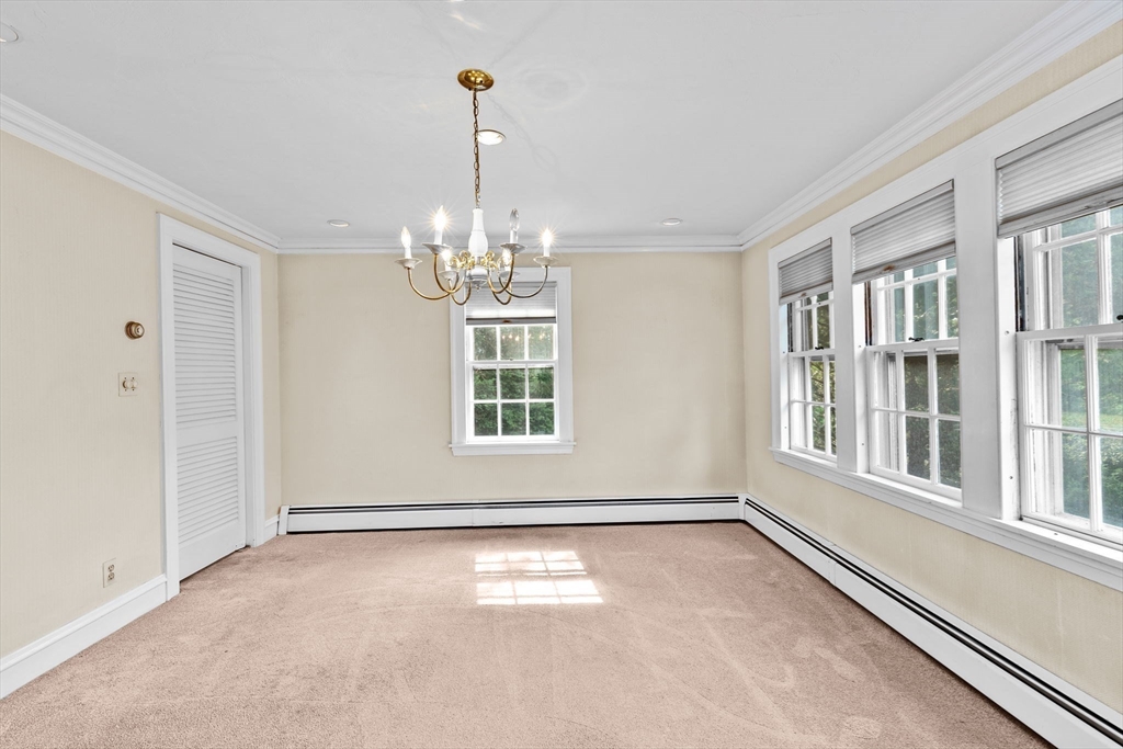 26 Holman Road Newton, MA 02466 - Photo 8 of 42 a view of an empty room with a window